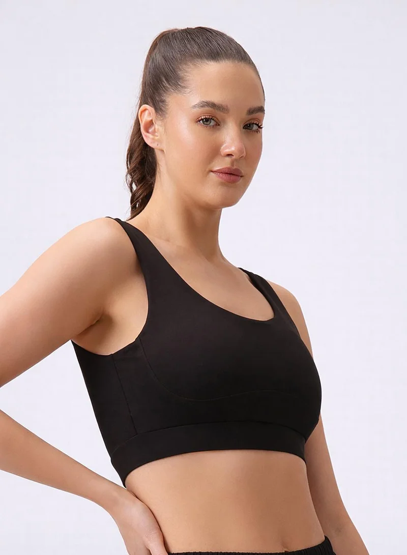 Clovia Black Medium Impact Sports Bra in Black with Removable Cups for Women | Best Price UAE